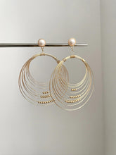Gold coil pearl earring