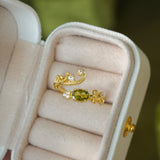 olive-green gemstone ring