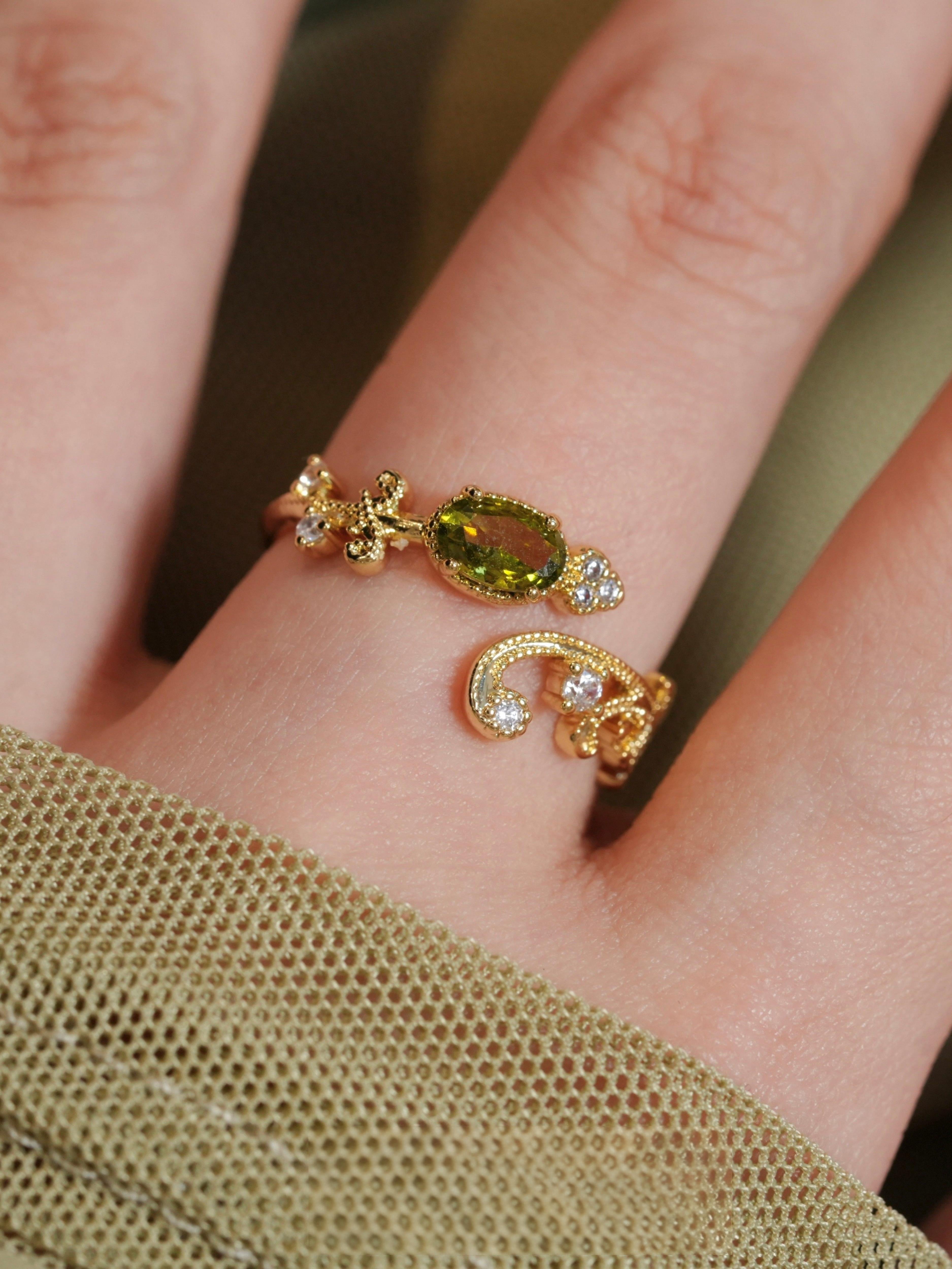 olive-green gemstone ring
